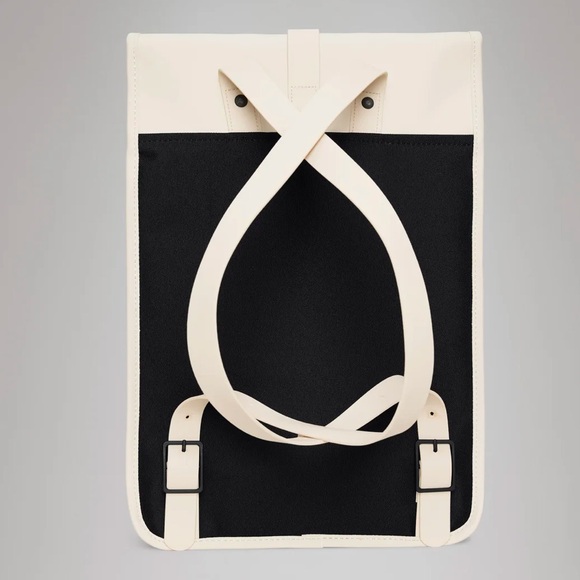 RAINS Shield Rucksack is a clean and functional backpack. Elegant Cream Backpack - Picture 4 of 11